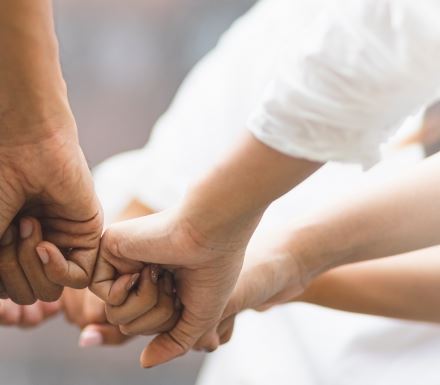 New Image people holding hands